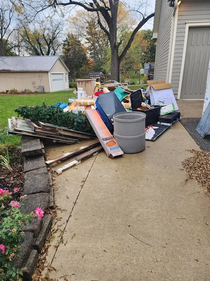 Dumpster being loaded with debris for Estate Cleanout Dumpster Rental in Lower Nazareth